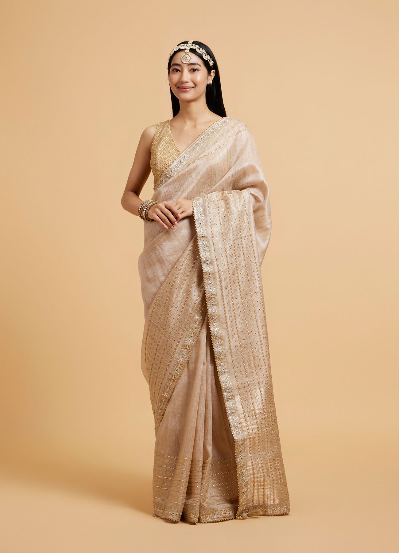 Mohey Women Light Fawn Linear Patterned Saree with Sequin and Stone Work