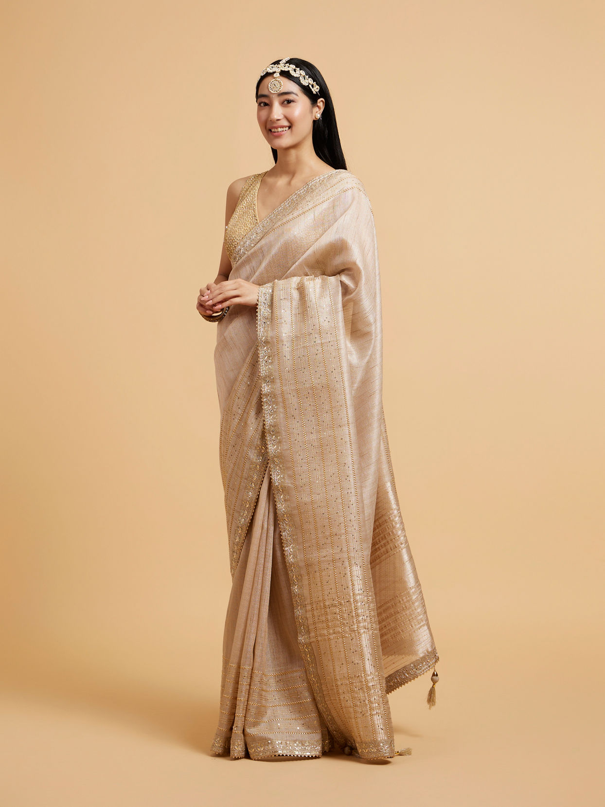 Mohey Women Light Fawn Linear Patterned Saree with Sequin and Stone Work