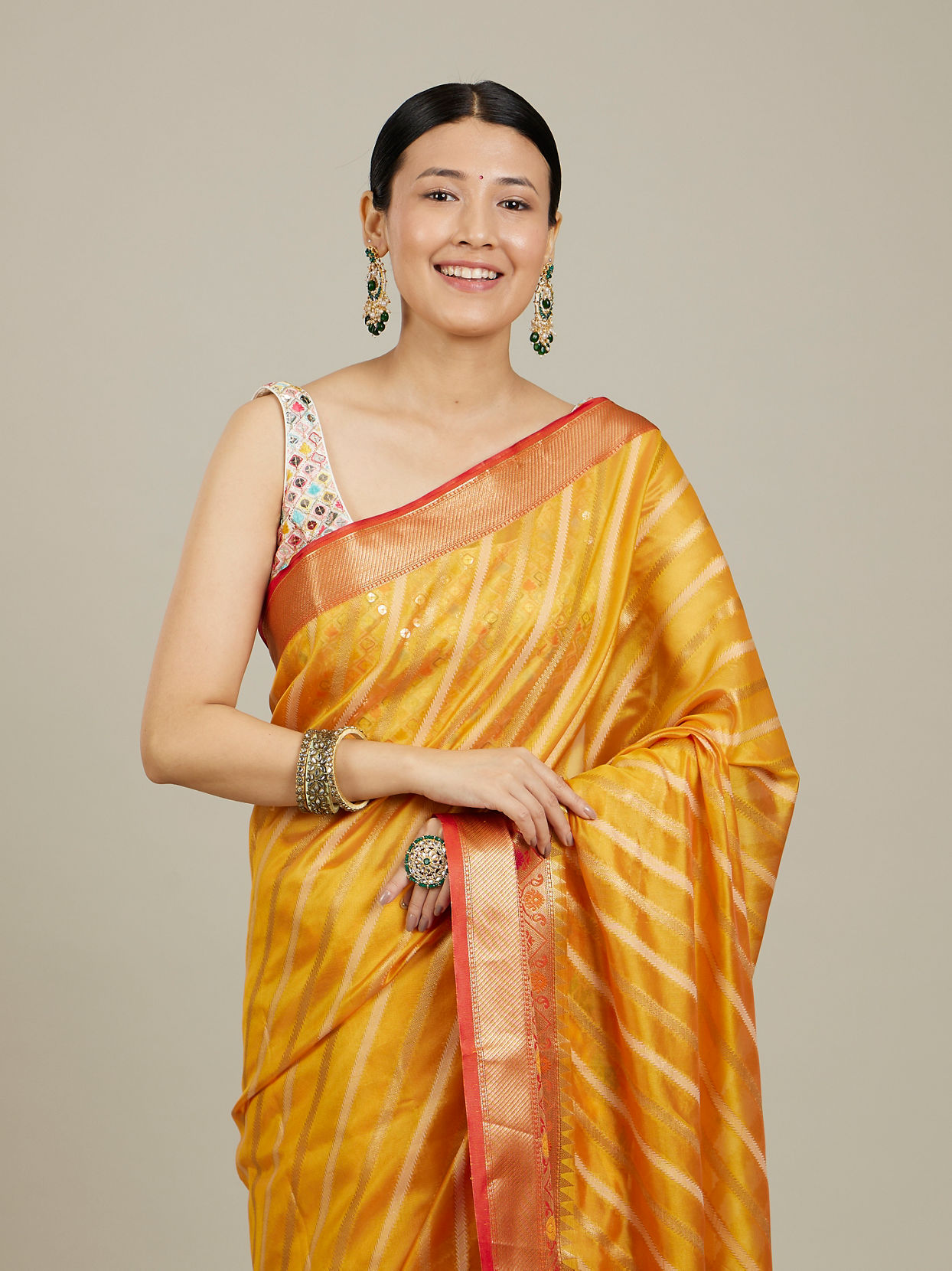 Mohey Women Mustard Yellow Striped Patterned Saree with Floral Motifs on the Border
