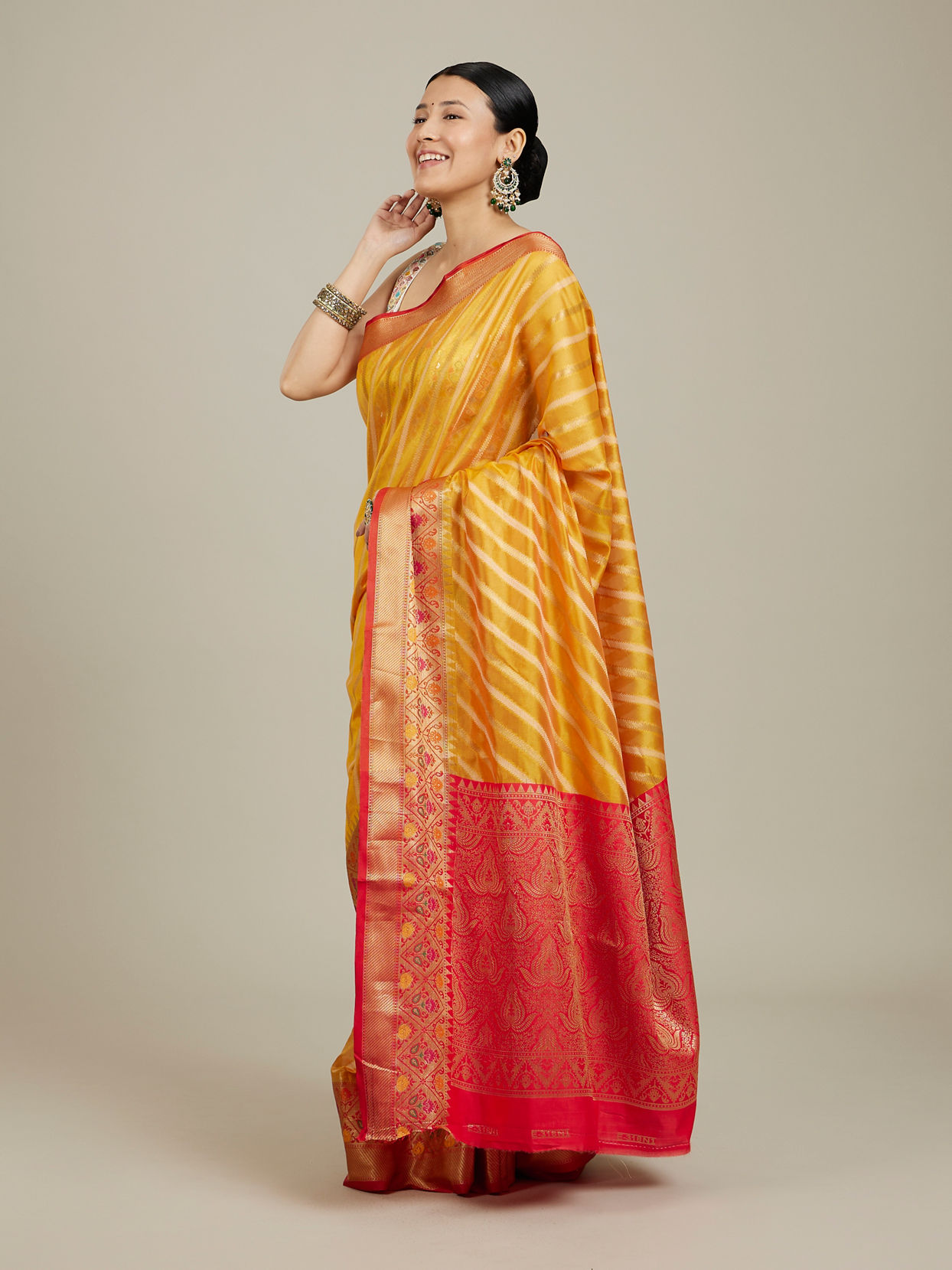 Mohey Women Mustard Yellow Striped Patterned Saree with Floral Motifs