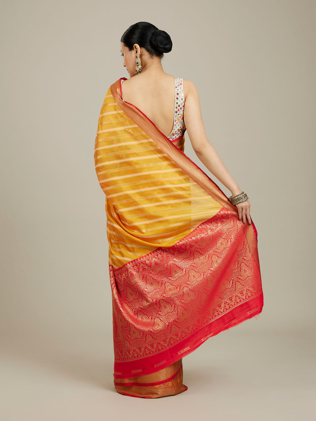 Mohey Women Mustard Yellow Striped Patterned Saree with Floral Motifs