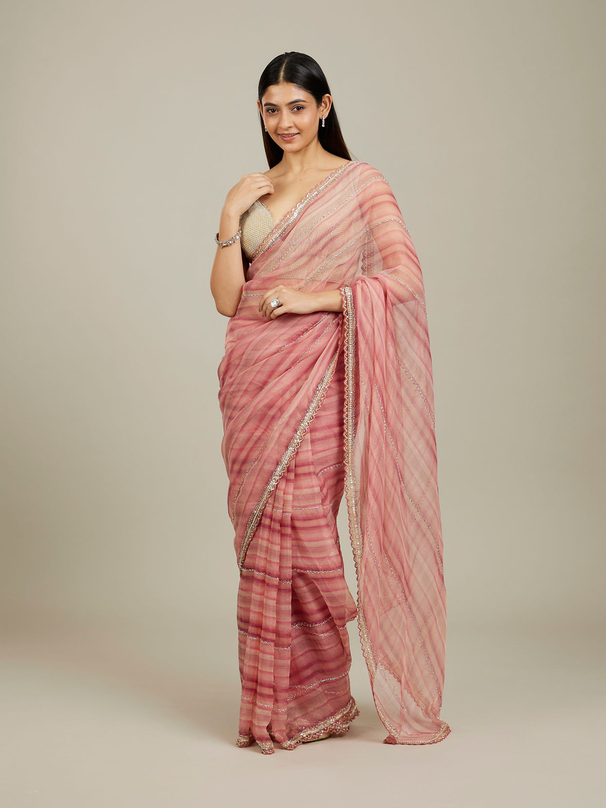 Mohey Women Coral Pink Diagonal Striped Saree with Cutdana And Sequin Work