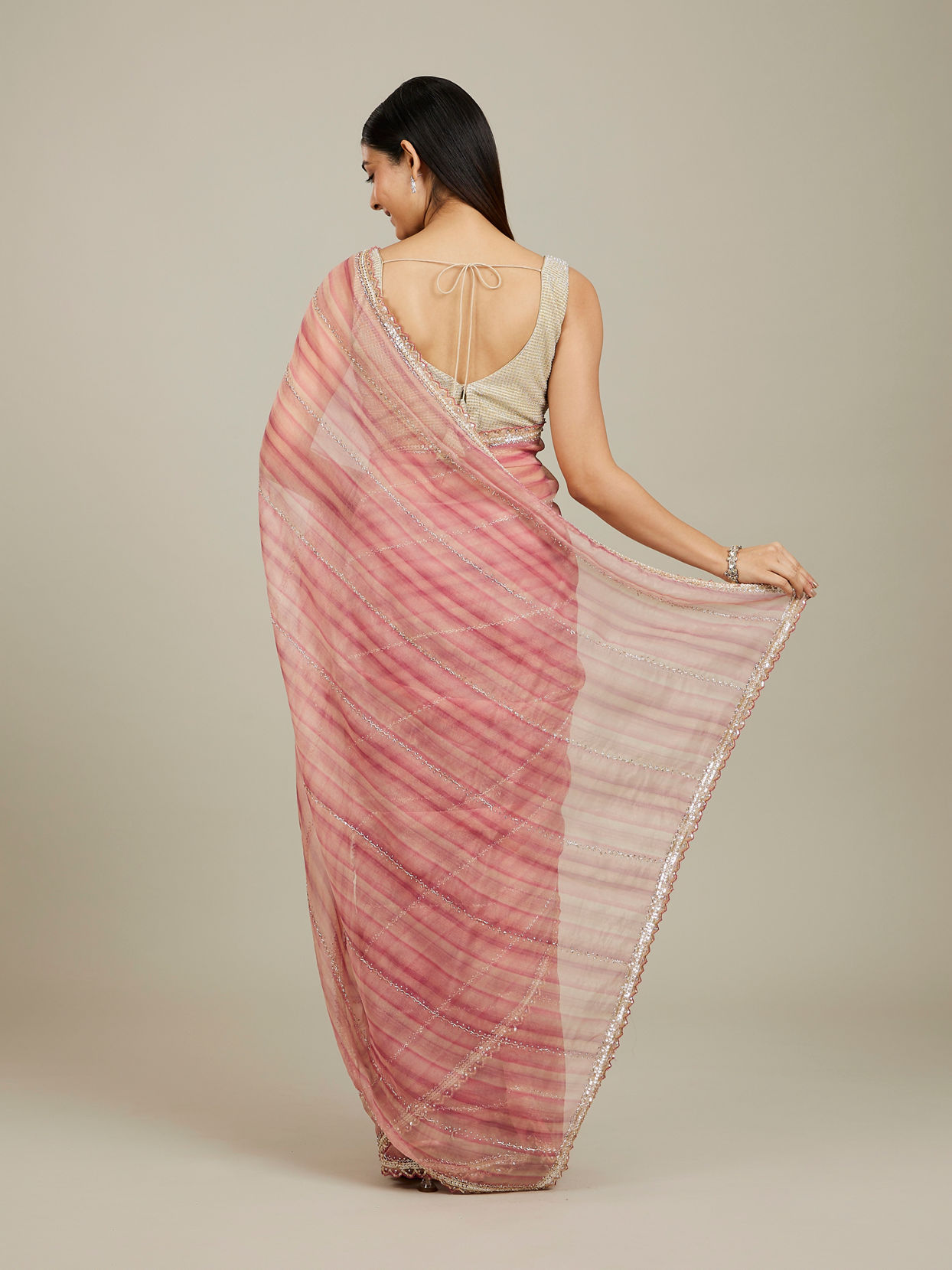 Mohey Women Coral Pink Diagonal Striped Saree with Cutdana And Sequin Work