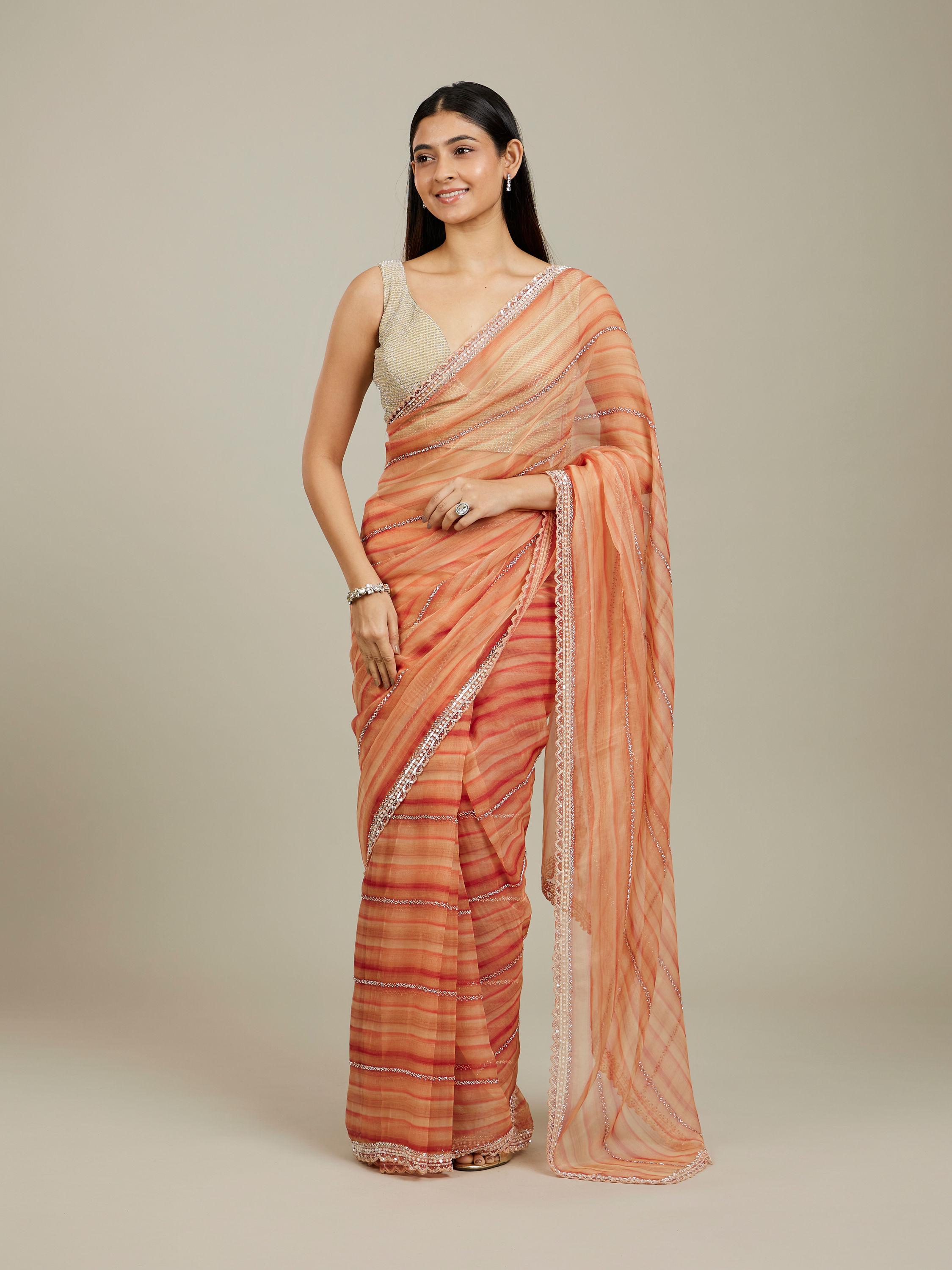 Mohey Women Rust Red Diagonal Striped Saree with Cutdana And Sequin Work