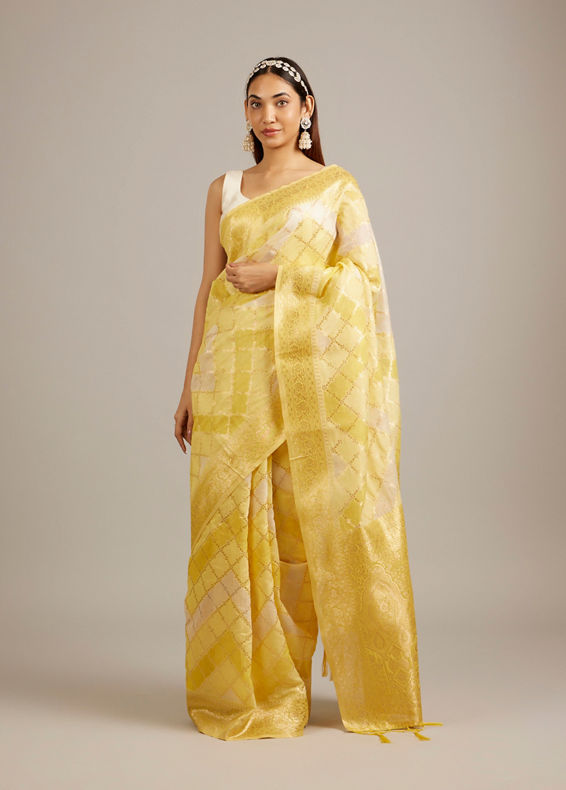 Mohey Women Canary Yellow Floral Grid Patterned Saree with Intricate Borders And Tassel Trims