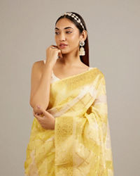 Mohey Women Canary Yellow Floral Grid Patterned Saree with Intricate Borders And Tassel Trims