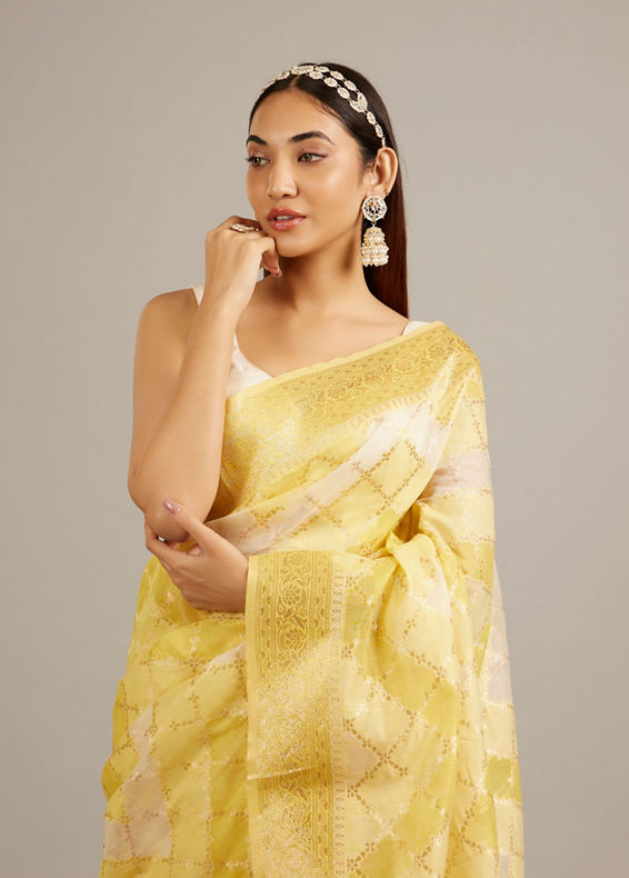 Mohey Women Canary Yellow Floral Grid Patterned Saree with Intricate Borders And Tassel Trims