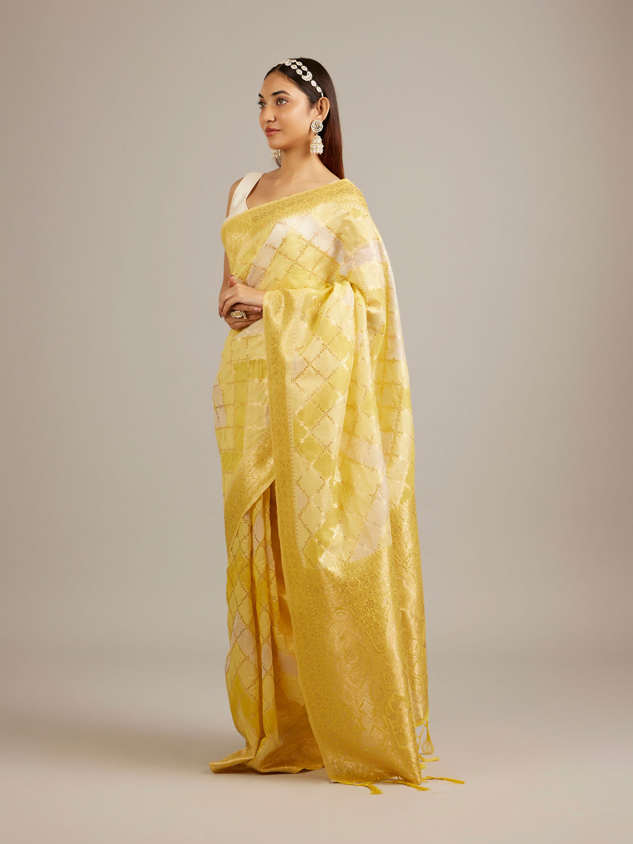 Mohey Women Canary Yellow Floral Grid Patterned Saree with Intricate Borders And Tassel Trims