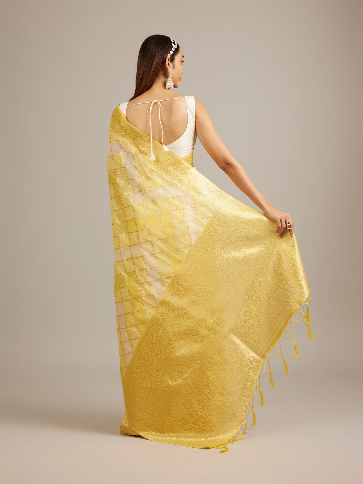 Mohey Women Canary Yellow Floral Grid Patterned Saree with Intricate Borders And Tassel Trims