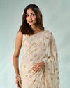 Mohey Women Cream Chiffon Saree with Cutdana Work