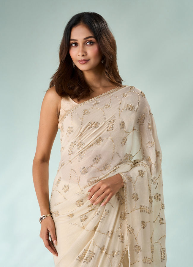 Mohey Women Cream Chiffon Saree with Cutdana Work