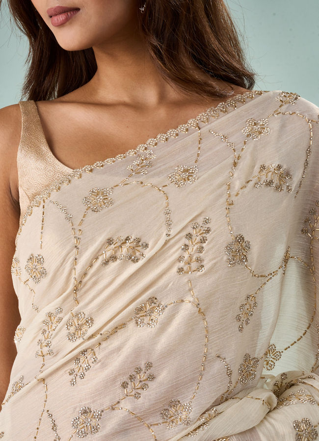 Mohey Women Cream Chiffon Saree with Cutdana Work