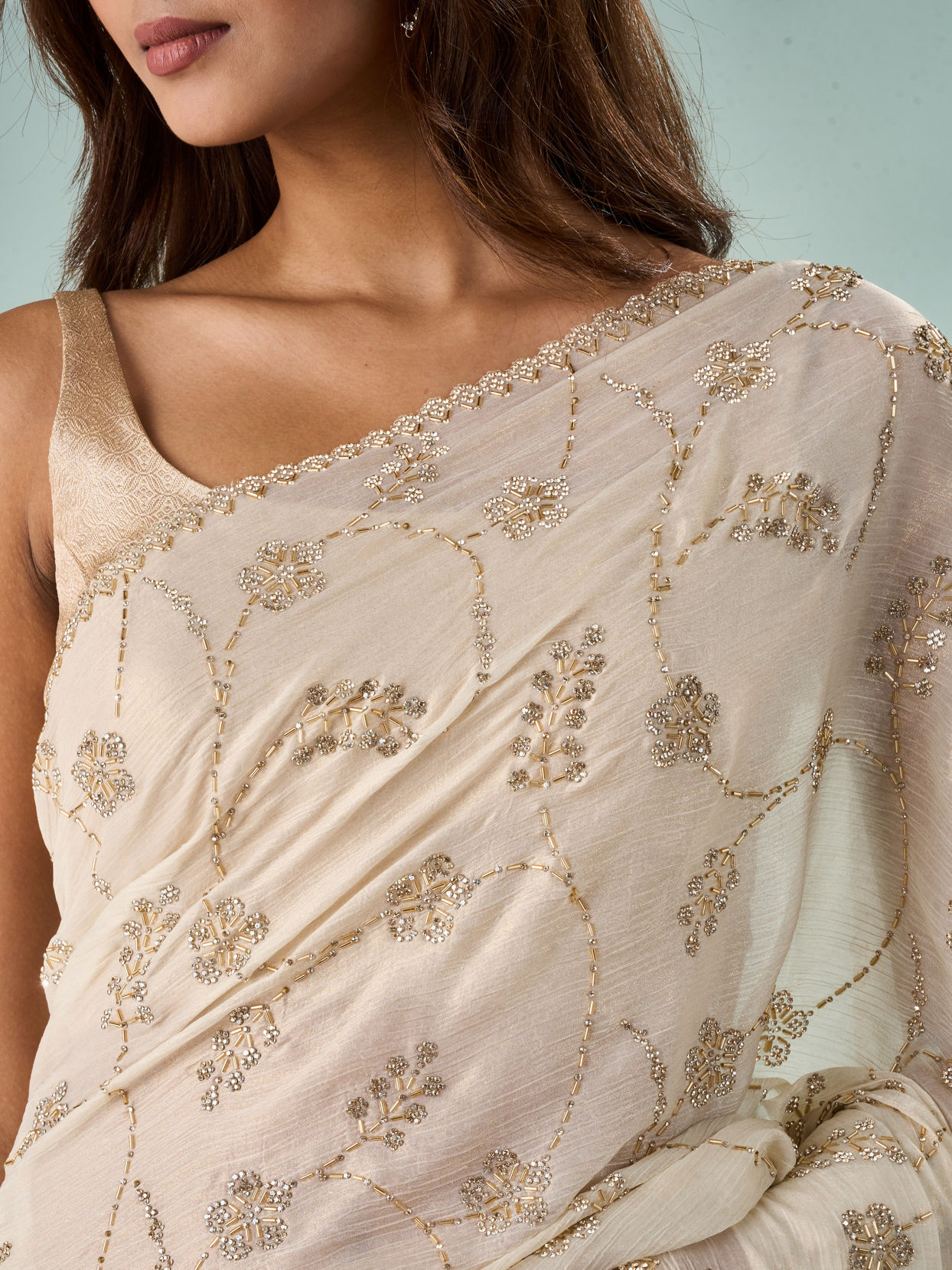 Mohey Women Cream Chiffon Saree with Cutdana Work