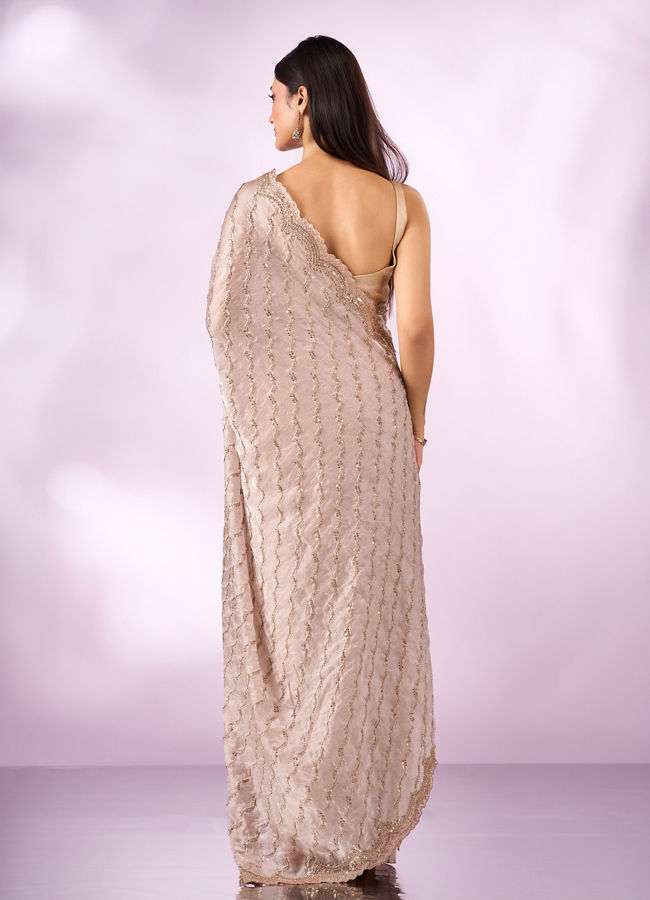 Mohey Women Cream Organza Saree with Cutdana Work