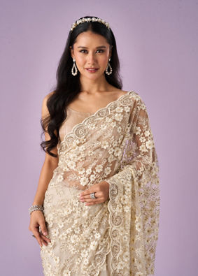 Mohey Women Cream Net Saree with Stone Work
