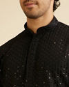 alt message - Manyavar Men Midnight Black Petal String Patterned Kurta Set with Mirror Work image number 1