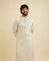 alt message - Manyavar Men Chalk White String Patterned Kurta Set with Mirror Work image number 0