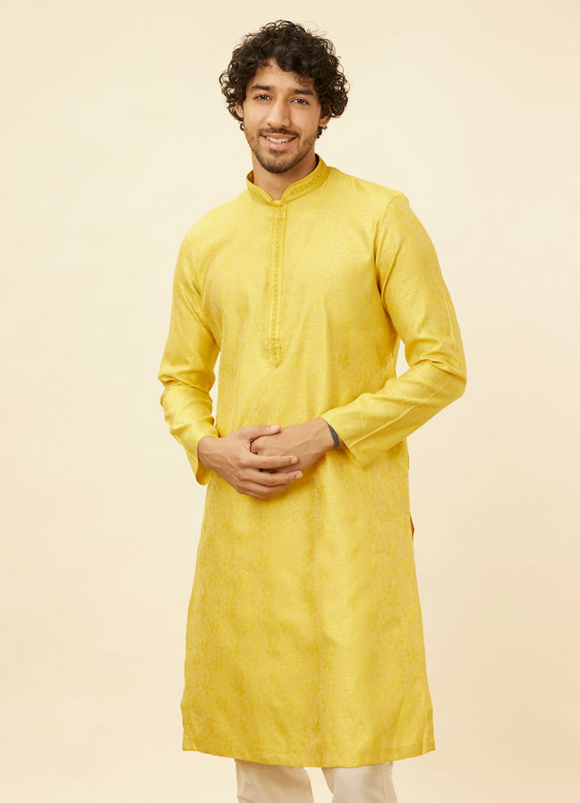 alt message - Manyavar Men Illuminating Yellow Bel Buti Patterned Kurta Set image number 0