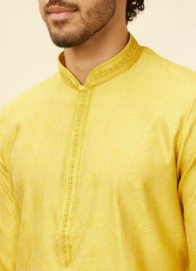 alt message - Manyavar Men Illuminating Yellow Bel Buti Patterned Kurta Set image number 1