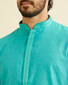 alt message - Manyavar Men Turquoise Blue Bel Buti Patterned Kurta Set image number 1