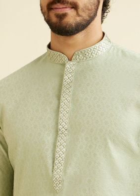 alt message - Manyavar Men Soft Green Floral Patterned Kurta Set image number 1