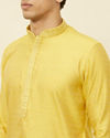 alt message - Manyavar Men Sunlight Yellow Self Patterned Kurta Set image number 1