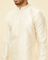 alt message - Manyavar Men Cloud Cream Self Patterned Kurta Set image number 1