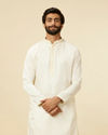 alt message - Manyavar Men Warm White Sequinned Striped Kurta Set image number 0