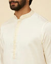 alt message - Manyavar Men Warm White Sequinned Striped Kurta Set image number 1