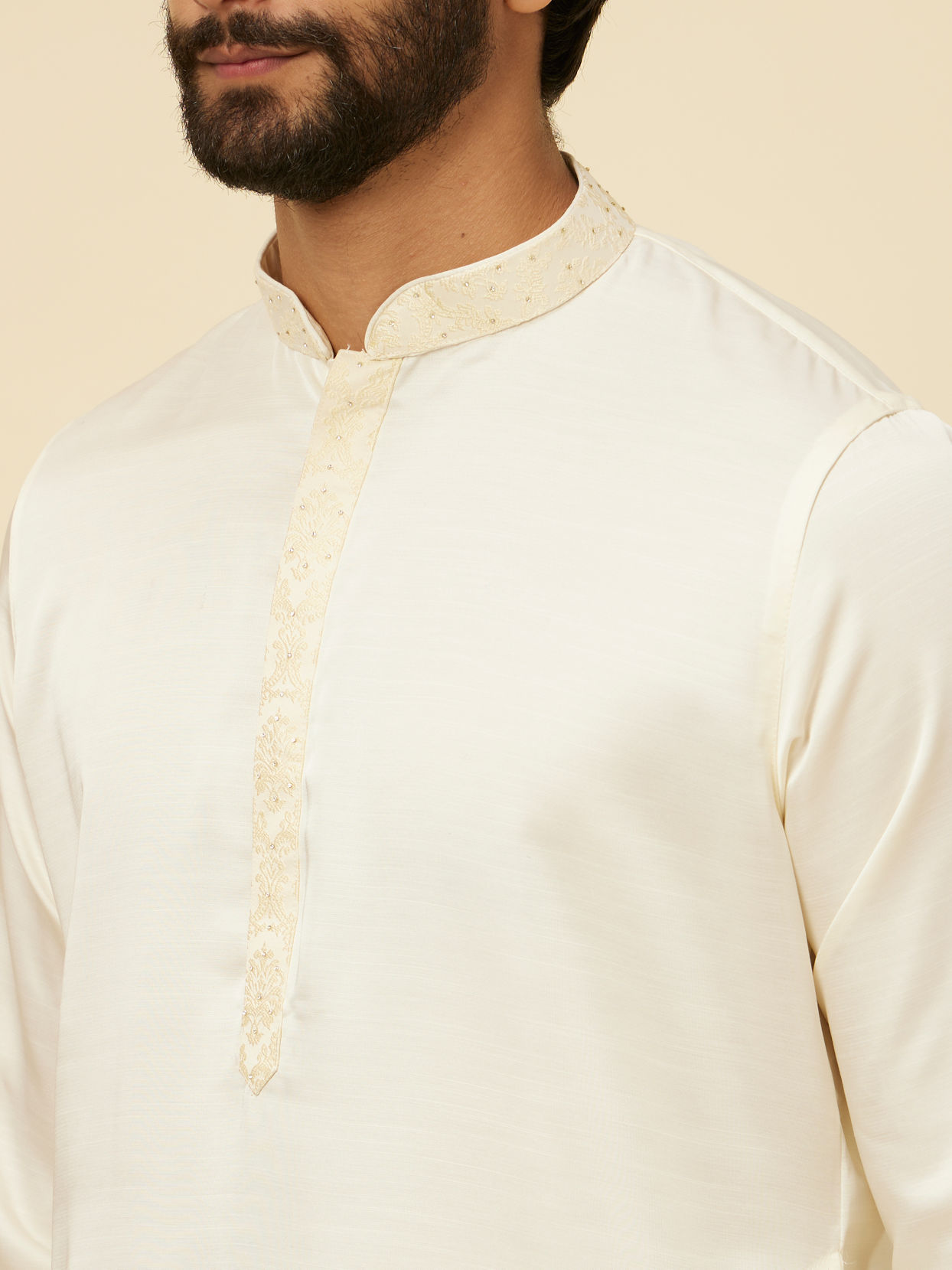 alt message - Manyavar Men Warm White Sequinned Striped Kurta Set image number 1