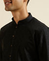 alt message - Manyavar Men Black Self Patterned Kurta Set image number 1