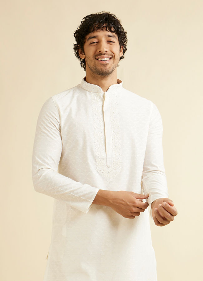 alt message - Manyavar Men Warm White Self Textured Kurta Set with Embroidered Neckline image number 0