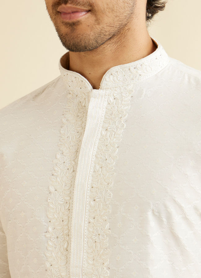 alt message - Manyavar Men Warm White Self Textured Kurta Set with Embroidered Neckline image number 1