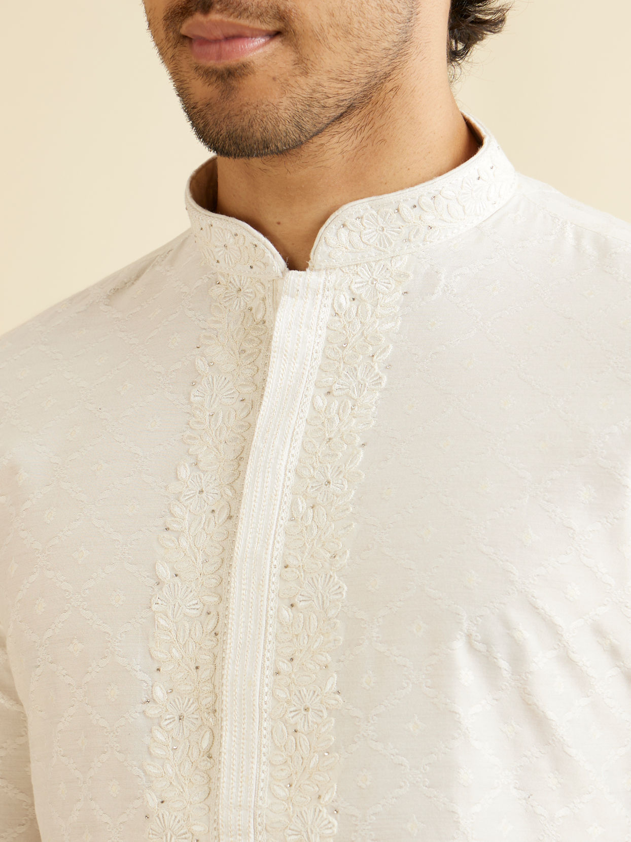 Manyavar Men Warm White Self Textured Kurta Set with Embroidered Neckline