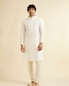 Manyavar Men Warm White Self Textured Kurta Set with Embroidered Neckline