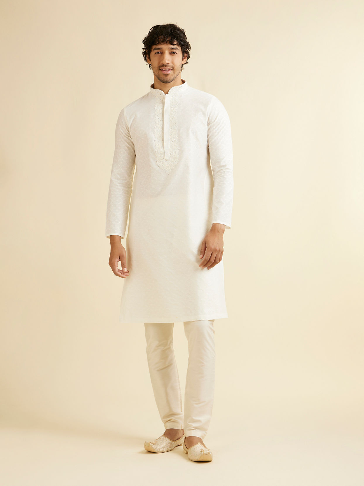Manyavar Men Warm White Self Textured Kurta Set with Embroidered Neckline