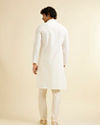 Manyavar Men Warm White Self Textured Kurta Set with Embroidered Neckline