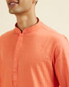 alt message - Manyavar Men Orange Plain Kurta Set image number 1