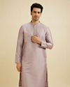 Soft Lilac Self Patterned Kurta Set with Embroidered Neckline