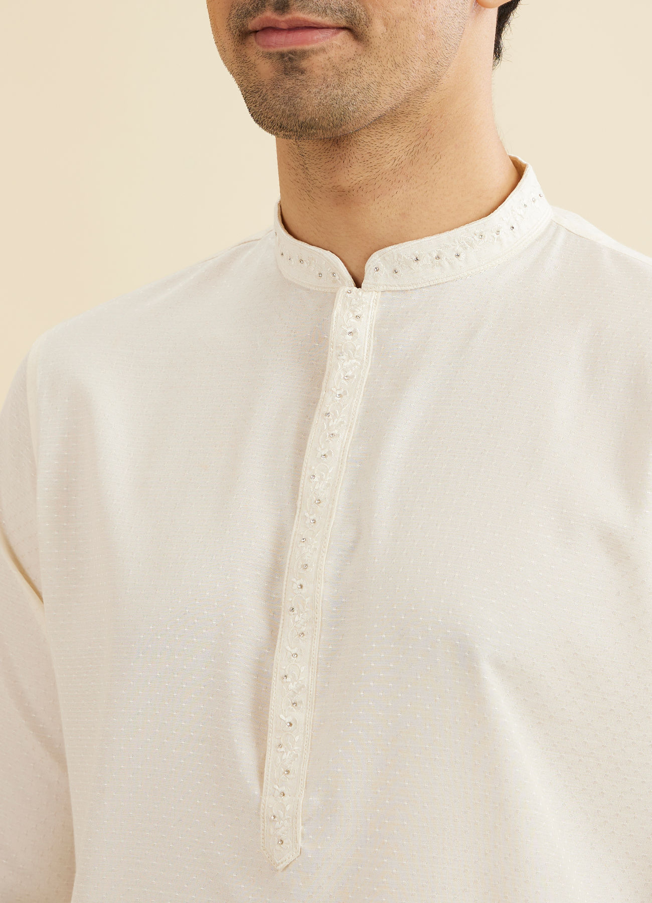 Manyavar Men Warm White Self Textured Kurta Set with Embellished Neckline