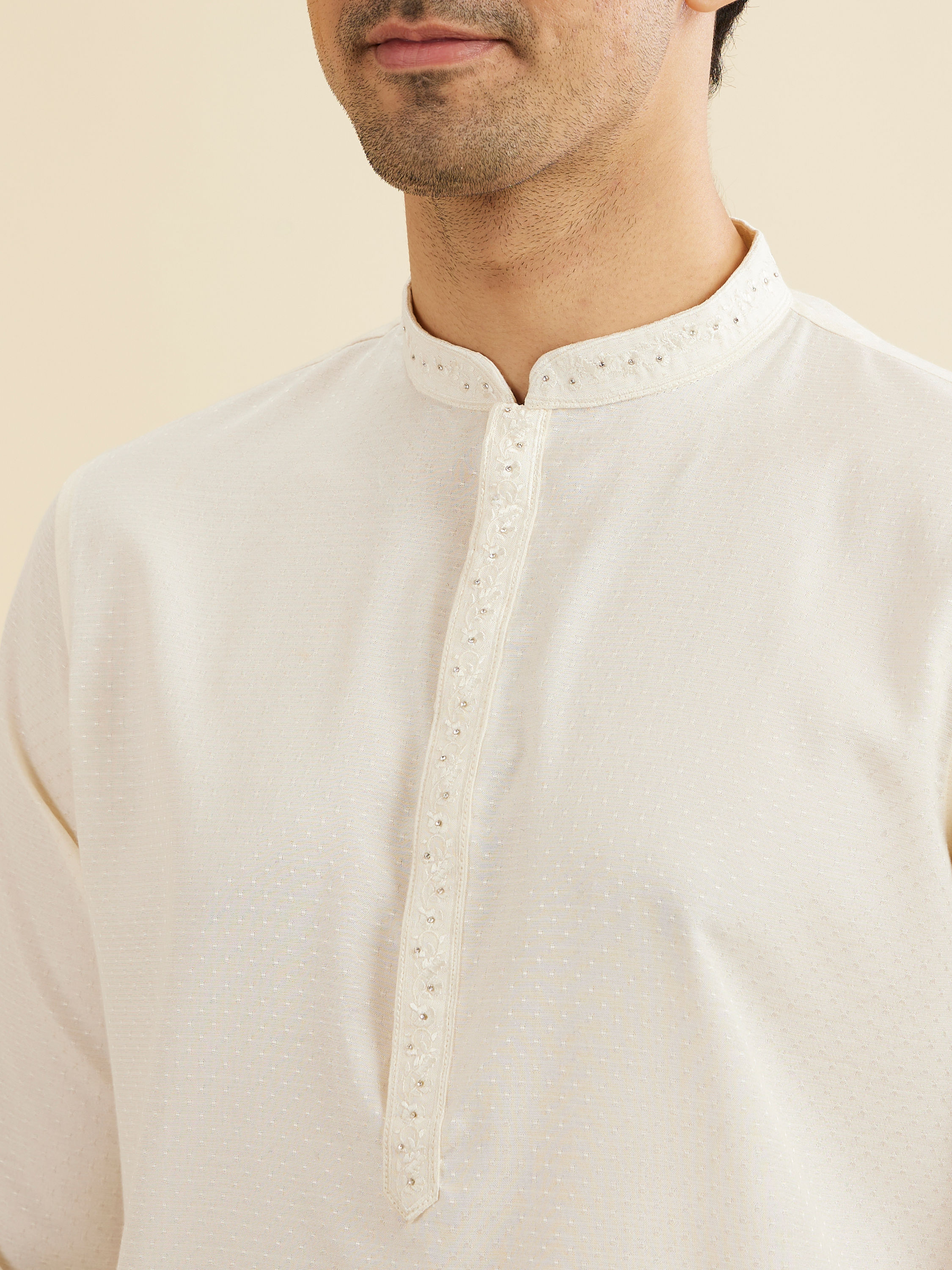 Manyavar Men Warm White Self Textured Kurta Set with Embellished Neckline