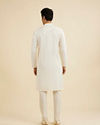 Manyavar Men Warm White Self Textured Kurta Set with Embellished Neckline