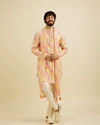 Manyavar Men Warm White and Pink Wave Print Kurta Set with Metallic Buta Highlights