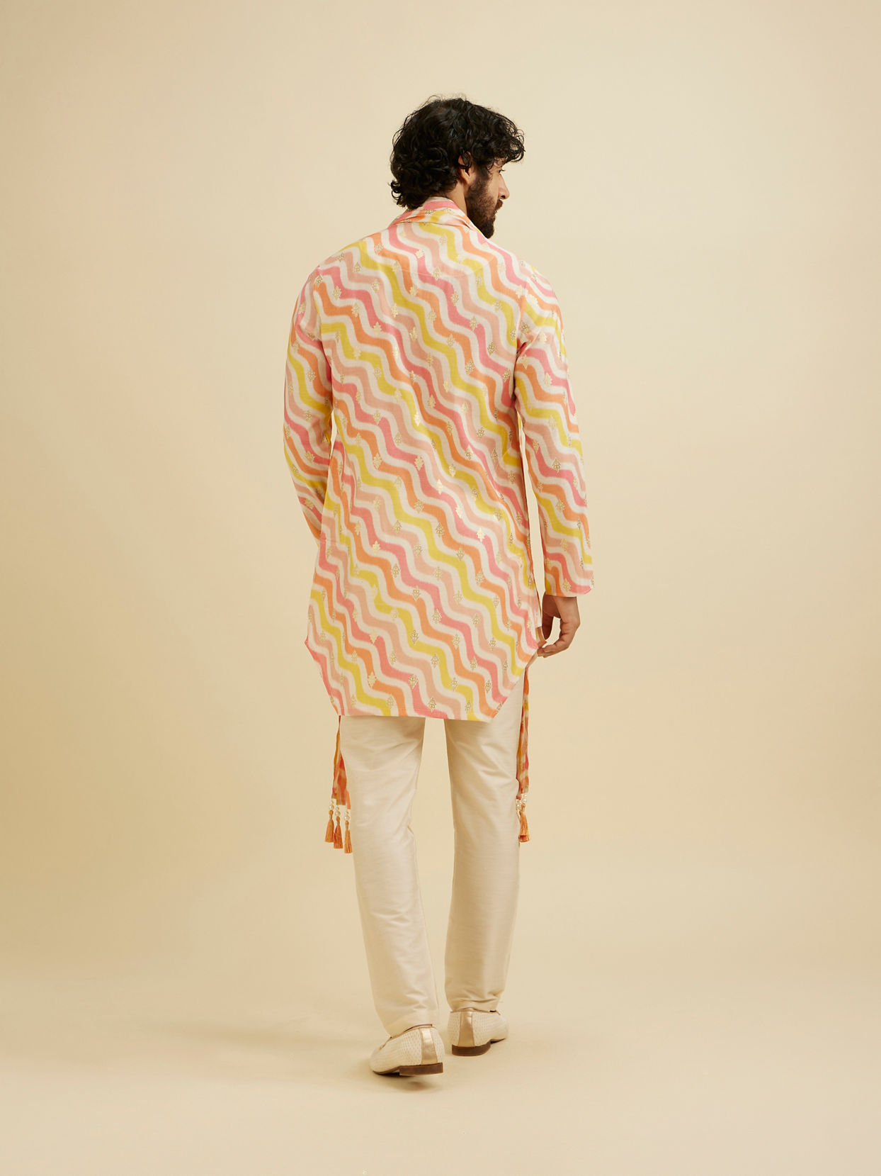 Manyavar Men Warm White and Pink Wave Print Kurta Set with Metallic Buta Highlights