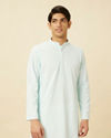 alt message - Manyavar Men Powder Blue Chikankari Embroidered Kurta Set image number 0