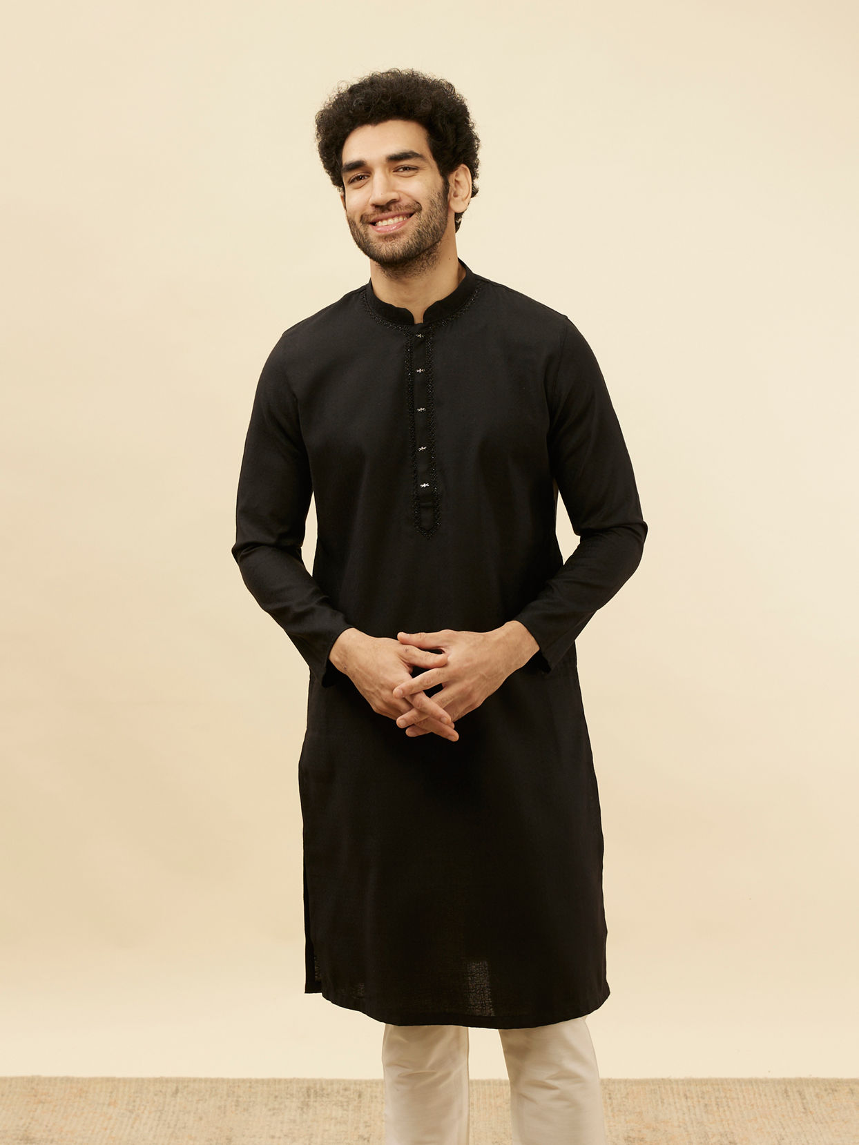 alt message - Manyavar Men Coal Black Embellished Neckline Kurta Set image number 0