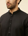 alt message - Manyavar Men Coal Black Embellished Neckline Kurta Set image number 1