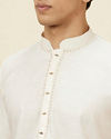 alt message - Manyavar Men Seashell White Embroidered Neckline Kurta Set image number 1