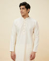 alt message - Manyavar Men Seashell White Embroidered Neckline Kurta Set image number 0