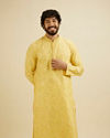 alt message - Manyavar Men Buttercup Yellow Bel Buti Patterned Kurta Set image number 0